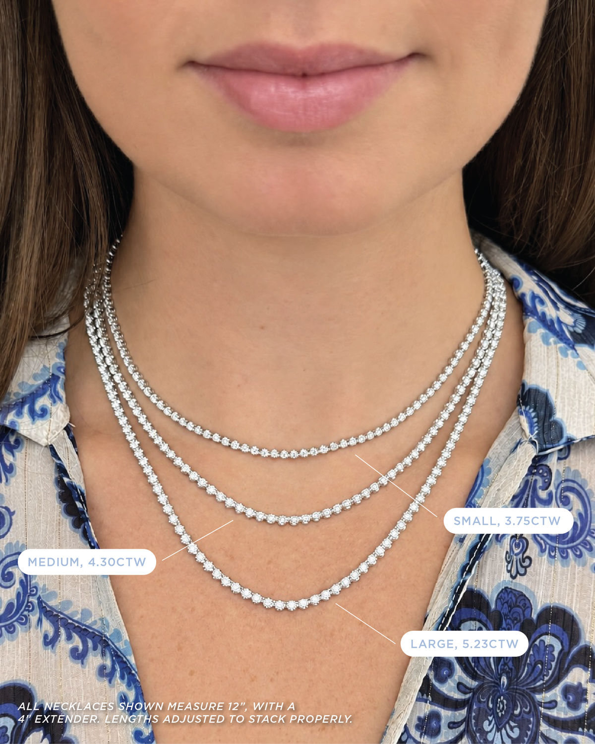 Model wearing three necklaces, displaying a small, medium, and large diamond necklace set in white gold.
