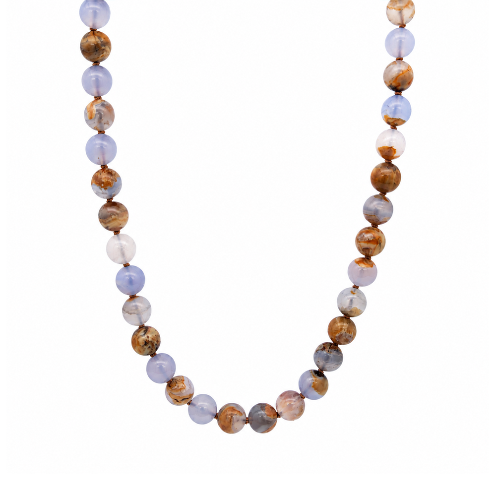 This beaded necklace features a strand of chalcedony stone beads that measure 8mm in diameter each. The 16 inch strand is finished with a sterling silver magnetic ball clasp.