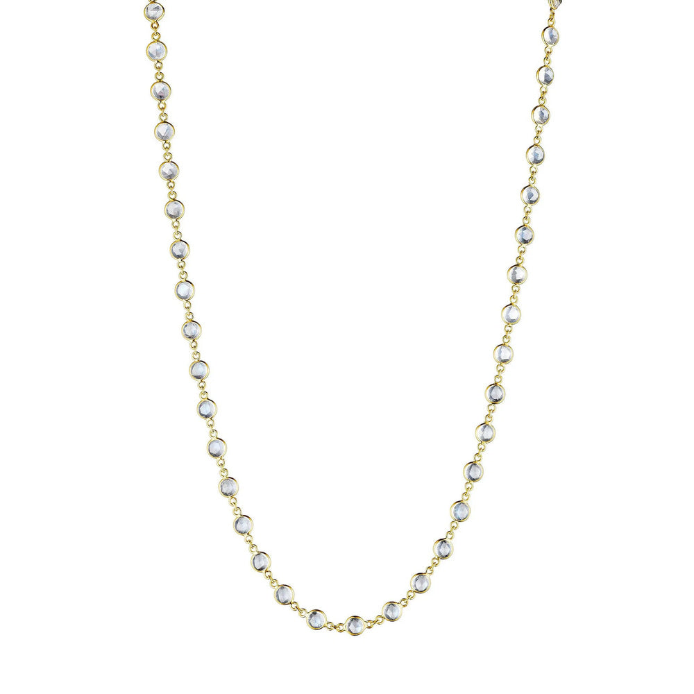 This 18k yellow gold necklace from Penny Preville features stations of bezel set round moonstones that measure 4mm in diameter. The necklace measures 18 inches in total length.
