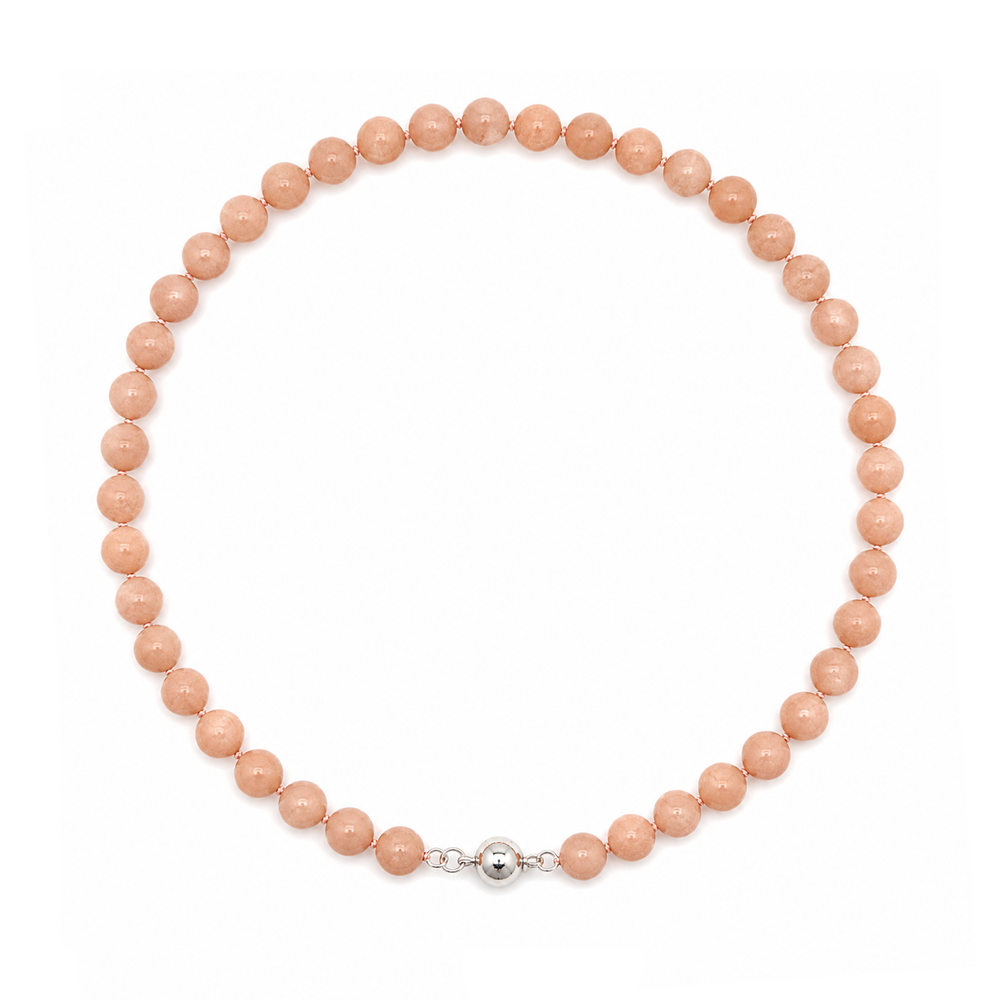 This beaded necklace features a strand of orange moonstone beads that measure 8mm in diameter each. The 16 inch strand is finished with a magnetic ball clasp.