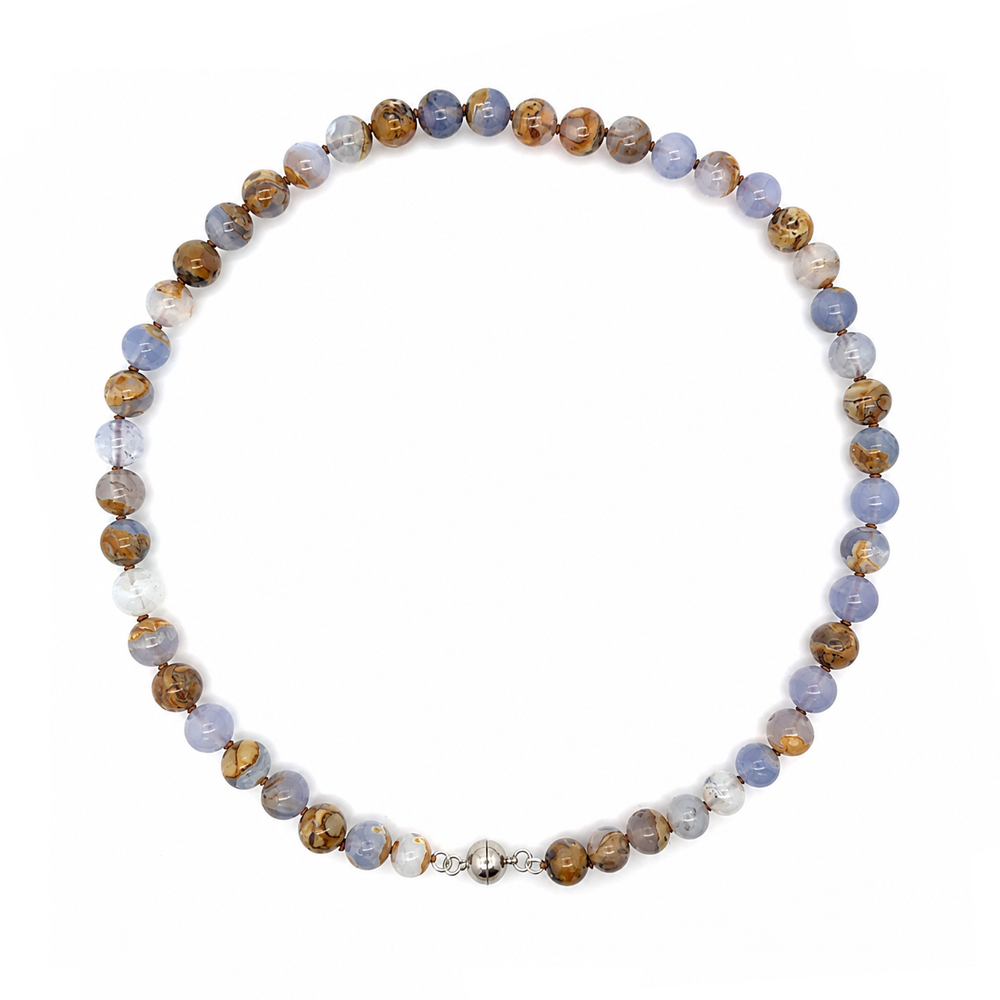 This beaded necklace features a strand of chalcedony stone beads that measure 8mm in diameter each. The 16 inch strand is finished with a sterling silver magnetic ball clasp.