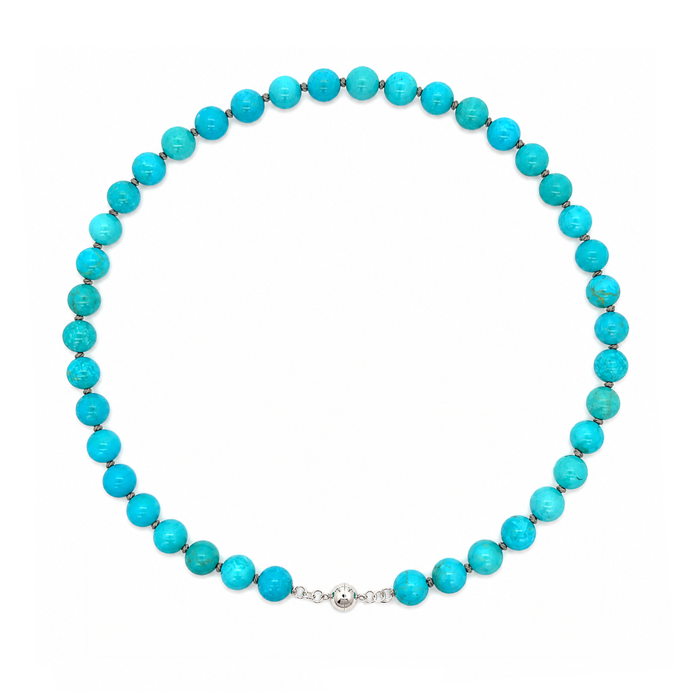 This beaded necklace features a strand of turquoise stone beads that measure 8mm in diameter each. The 16 inch strand is finished with a sterling silver magnetic ball clasp.