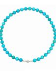 This beaded necklace features a strand of turquoise stone beads that measure 8mm in diameter each. The 16 inch strand is finished with a sterling silver magnetic ball clasp.
