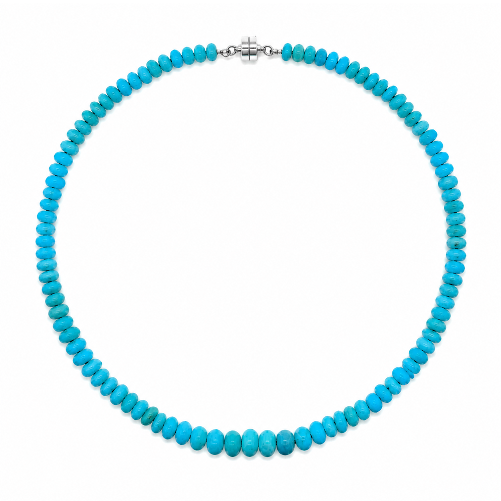 This beaded necklace showcases graduated blue opal gemstones, with the largest stones centered. The strand is finished with a sterling silver magnetic clasp and measures 16 inches. Wear this necklace on its own or as the statement piece for a layered necklace stack.