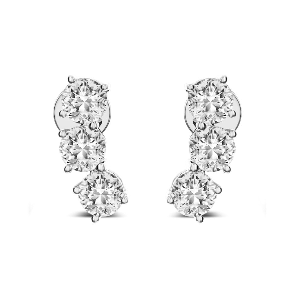 These 18k white gold "ear climber" earrings feature a trio row of round diamonds each that total 0.95ctw. The earrings are finished with post backings on the first diamond, allowing the diamonds to appear as if they are "climbing" up the ear.