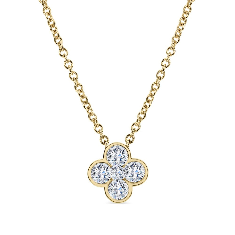 This 18k yellow gold necklace features a clover style pendant with four larger round diamonds that total 0.70ctw with a smaller center round diamond that totals 0.10ctw. The clover is bezel set and suspends from a gold chain.