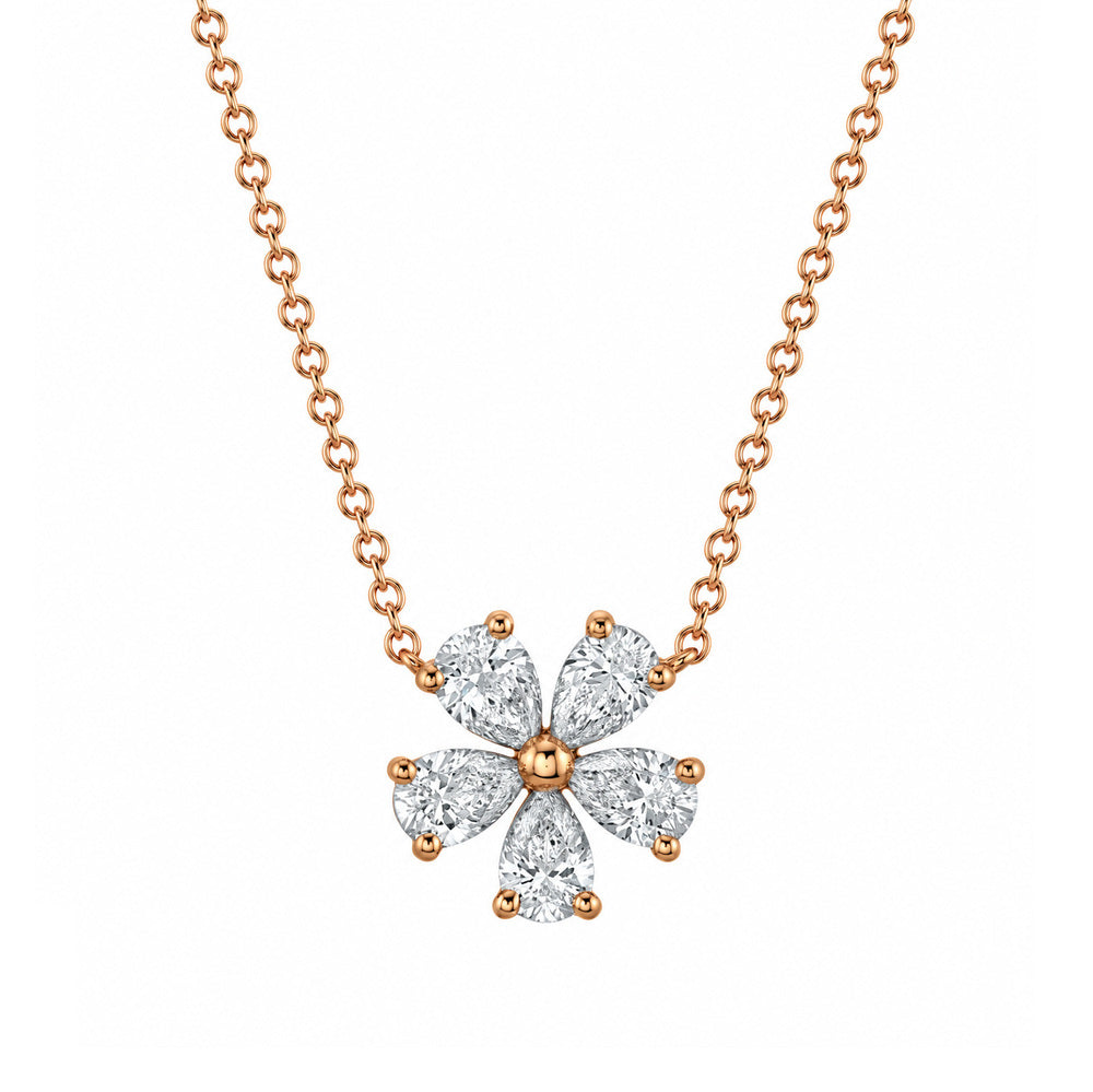 This 18k rose gold necklace features five pear shaped diamonds set in the shape of a flower that total 0.92ctw.