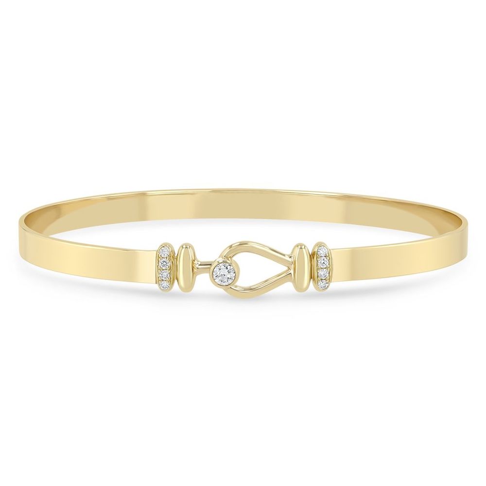 This 14k yellow gold bracelet from Zoe Chicco features a hook closure with bezel set diamonds that total 0.18ctw.