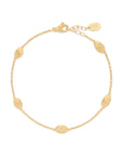 Yellow gold bracelet chain with five stations of hand engraved beads. Lobster clasp with chain extender. On a white background.