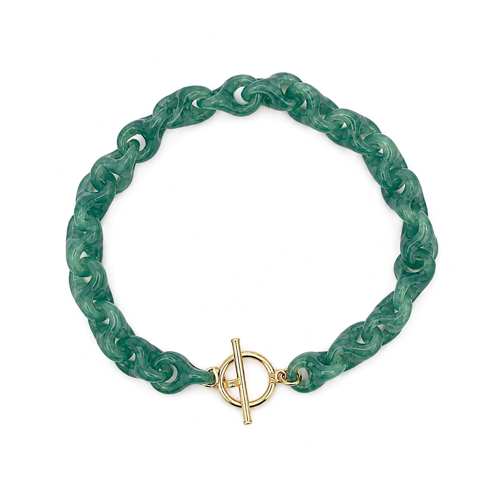 Jade link bracelet with toggle clasp in yellow gold.